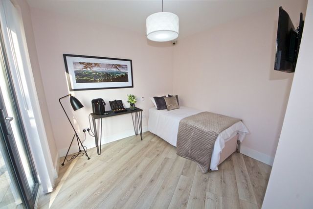 Wood laminate flooring in a bedroom